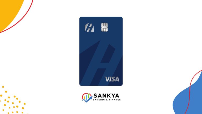 Home Trust Preferred Visa credit card in dark blue with a prominent 'H' logo and chip, issued by Sankya Banking & Finance, displayed on a white background with colorful abstract elements.