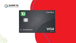 A close-up of the TD Cash Back Visa Infinite Card featuring its sleek black design with a geometric pattern. The card displays the TD logo, the Visa Infinite branding, and is personalized with the name 'G. RAYMOND.' The background is a bold red and blue design, highlighting the card's modern aesthetic. This image represents the TD Cash Back Visa Infinite Card, known for offering cashback rewards on eligible purchases.