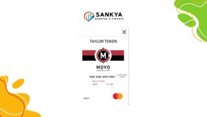 Illustration of a MOVO® Digital CASH Card® issued to "Taylor Token", displayed under the Sankya Banking & Finance logo, featuring Mastercard and debit labels with a digital card layout.
